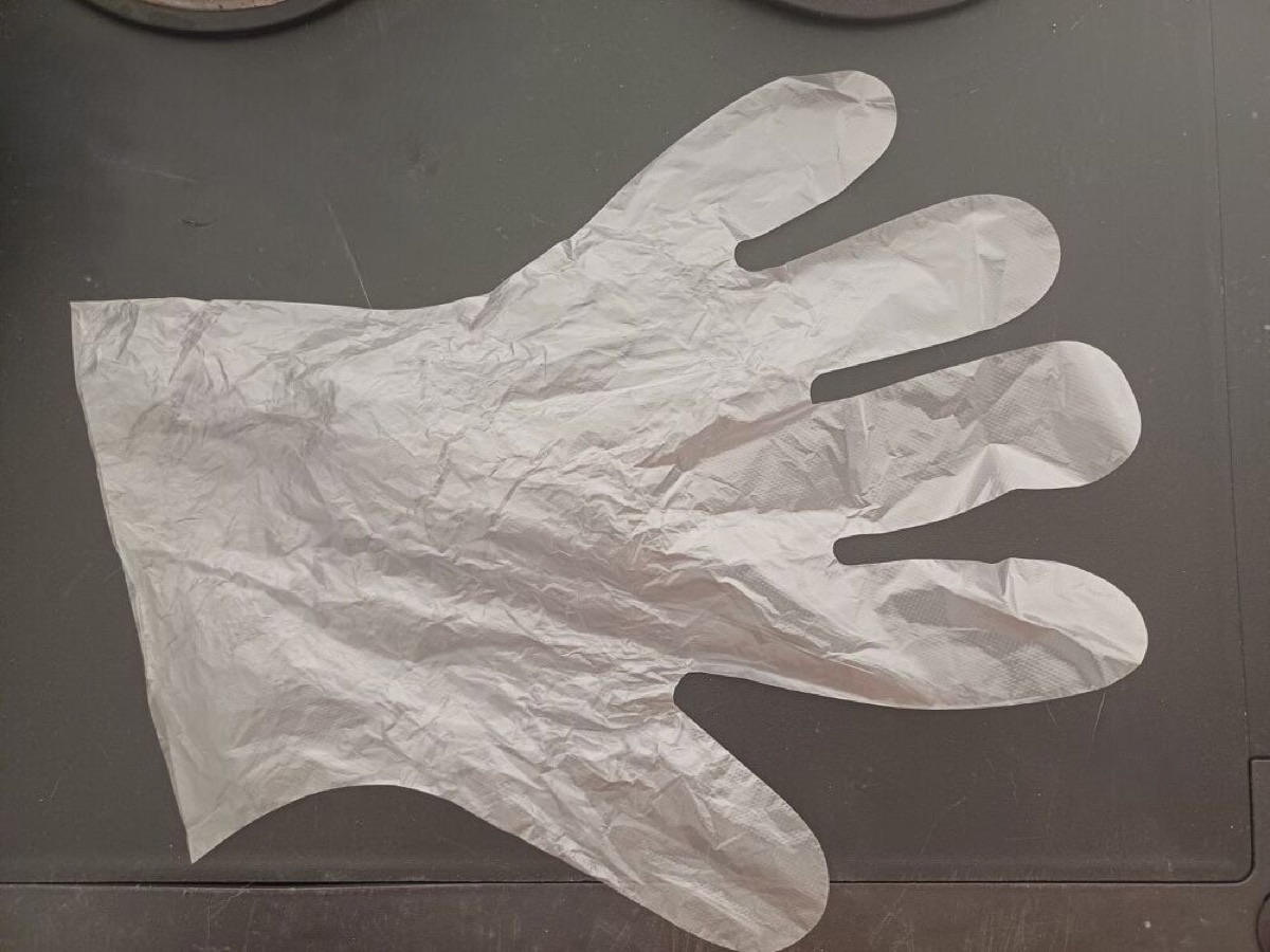 Keep your toothbrush clean and separated with a disposable glove – a clever travel hack!